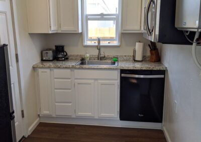 Refinished cabinets to white, new counter top in Grand Junction