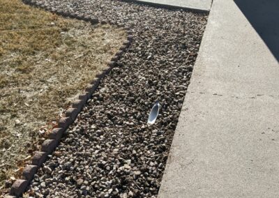 Rerouted gutter to drain under sidewalk Grand Valley Repair in Grand Junction